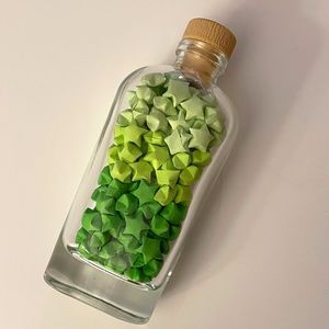 Green luck stars in a bottle